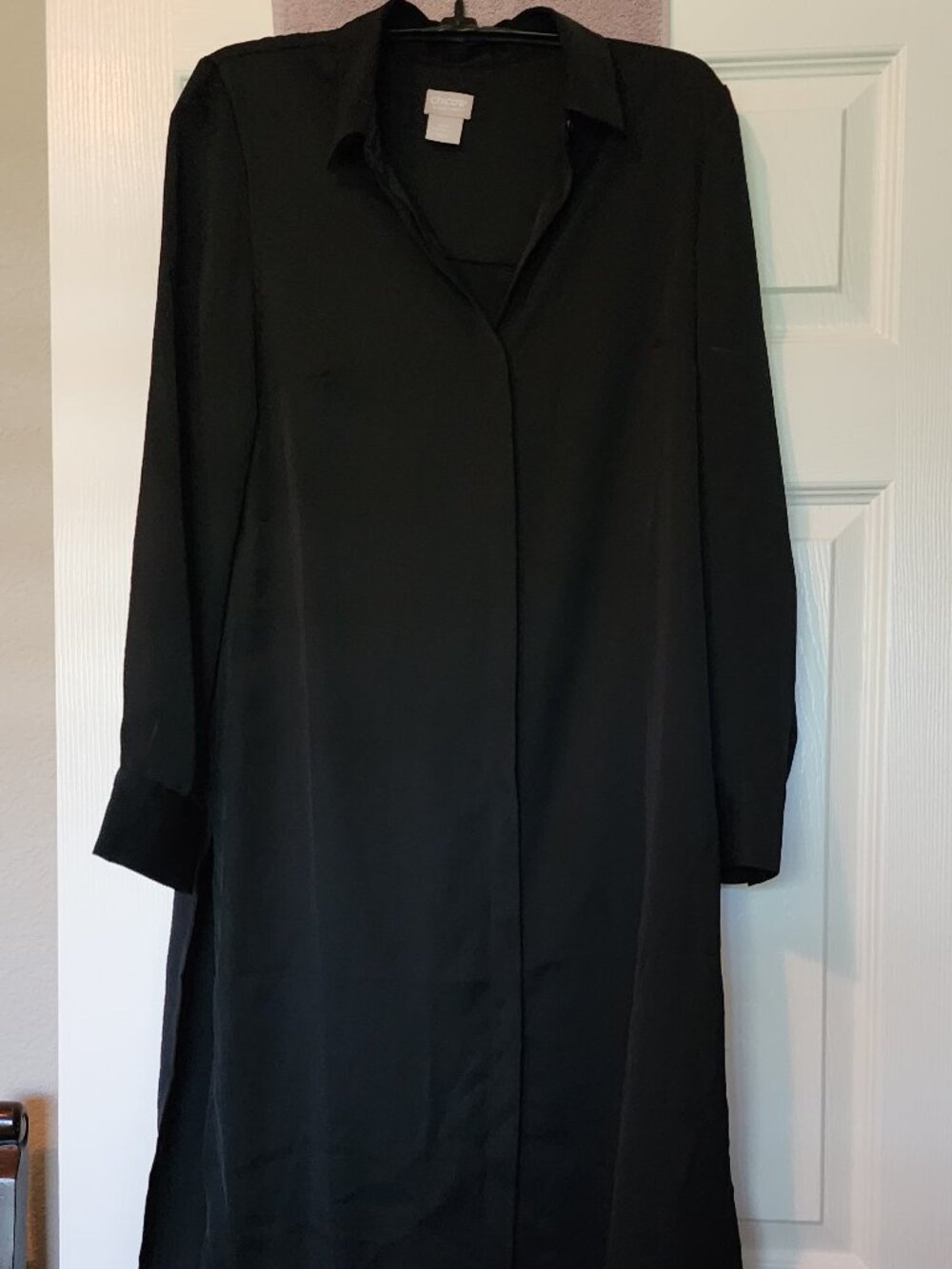 Black mid length tailored dress. Simple with open back and side slits.